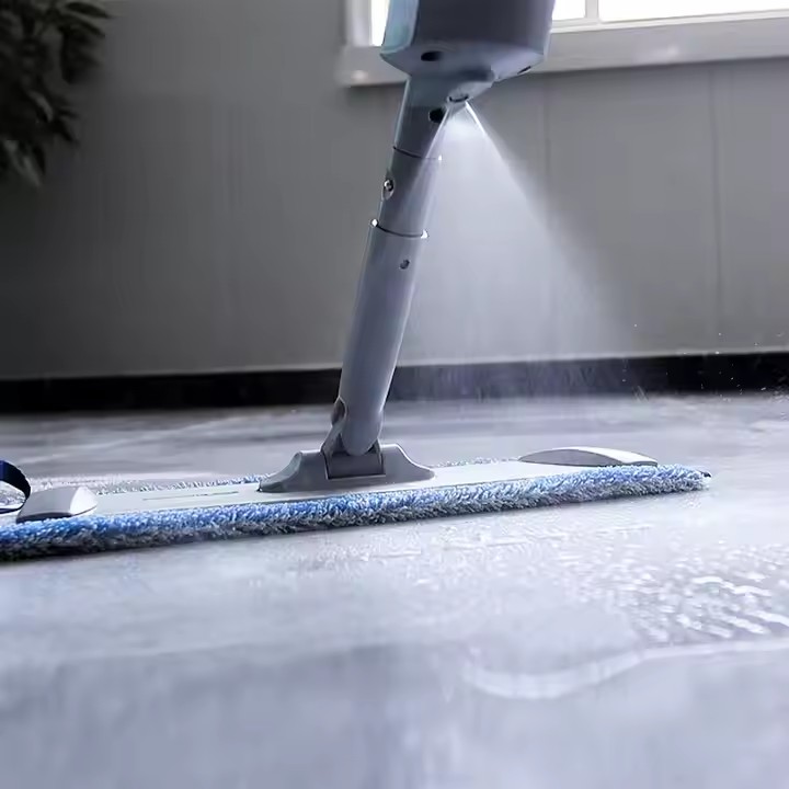 Home cleaning spray mop with 360-degree swivel head and refillable water bottle