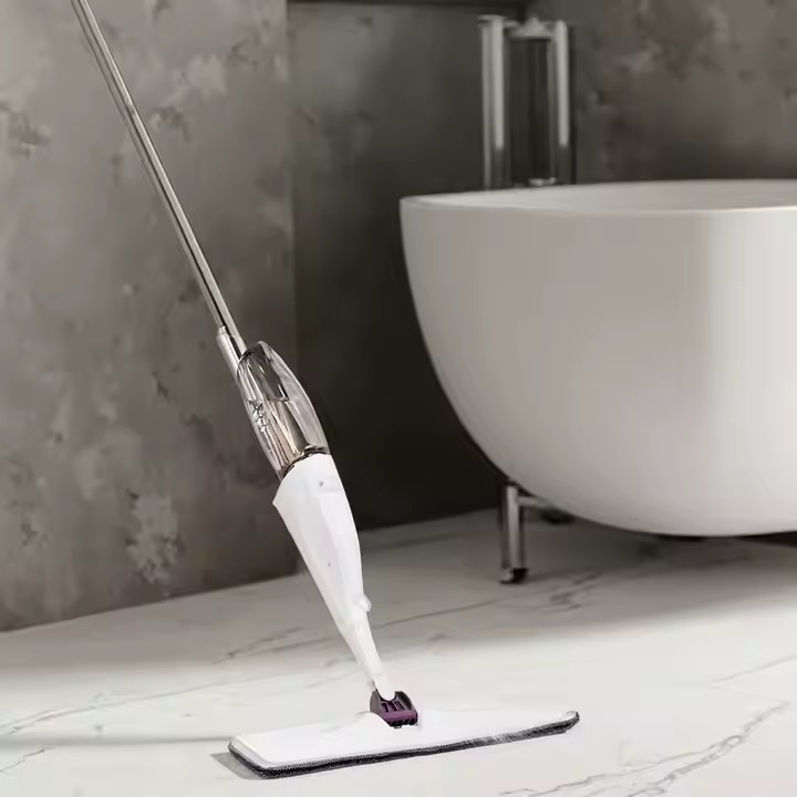 Magic flat spray mop with microfiber pad, ergonomic handle, and 360-degree swivel head