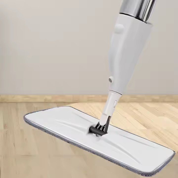Magic flat spray mop with microfiber pad, ergonomic handle, and 360-degree swivel head